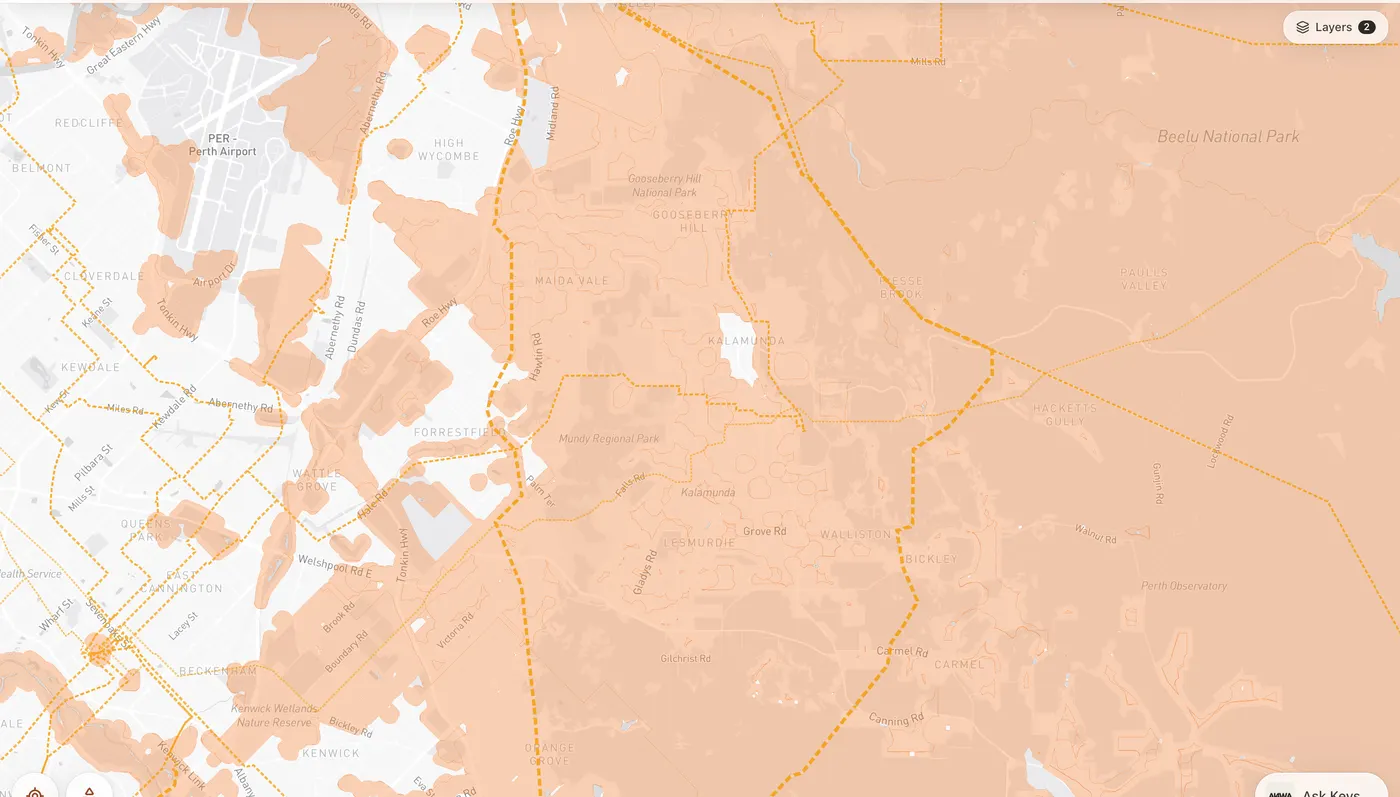 Map of the Kalamunda hills with bushfire prone areas shaded orange and high-voltage transmission lines dashed